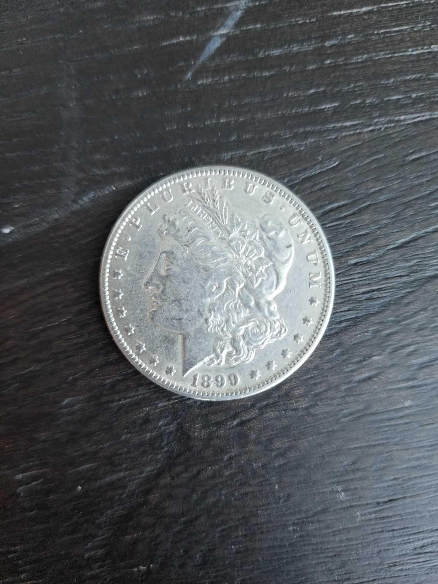 1899 AU Graded Morgan Silver Dollar