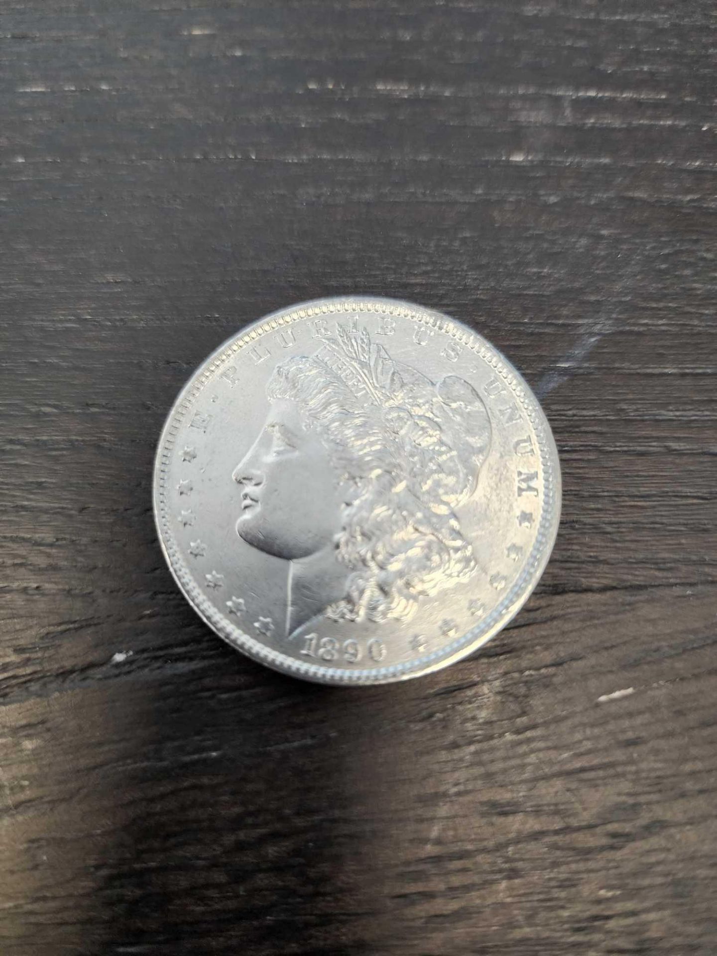 1890 AU Graded Morgan Silver Dollar