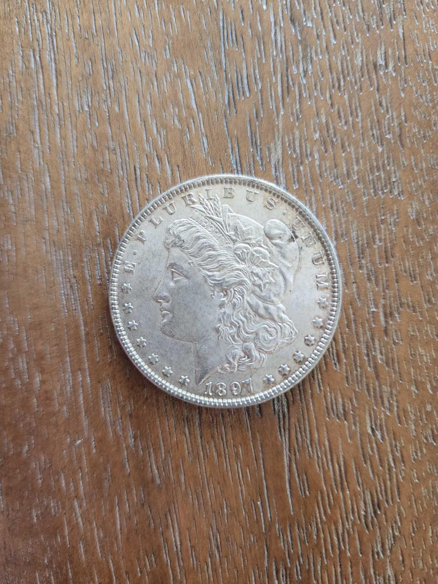 1897 AU Graded Morgan Dollar