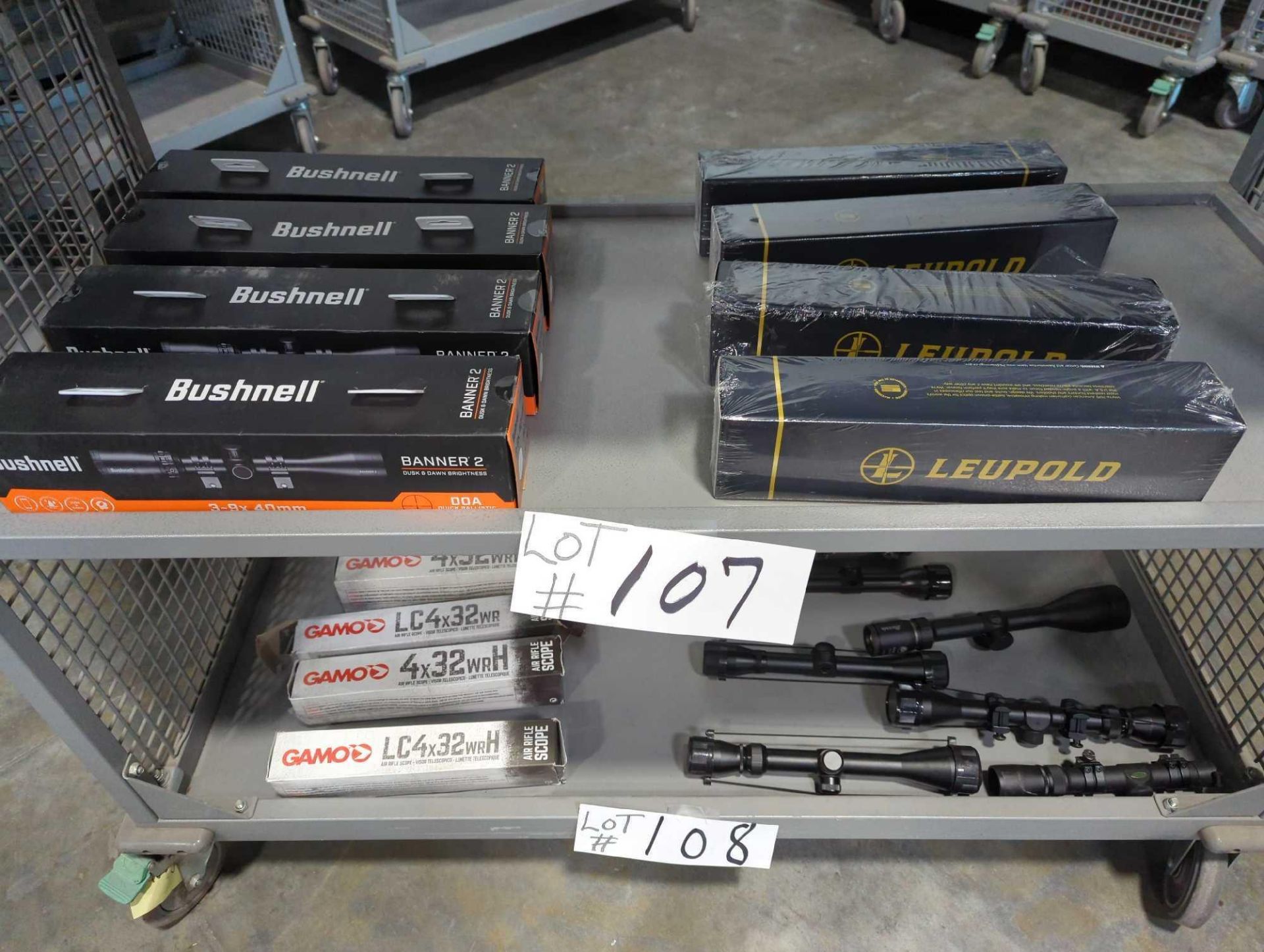 shelf of bushnell and leupold scopes