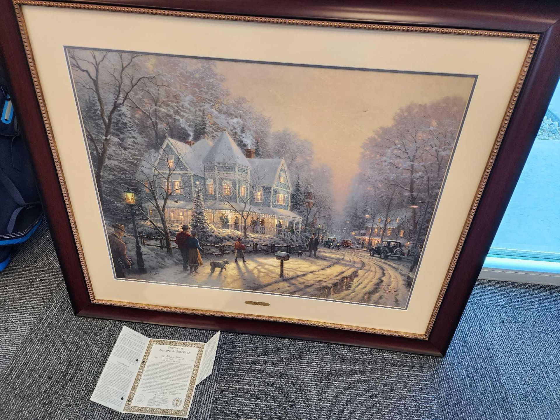 A Holiday Gathering by Thomas Kinkade 25x34. with frame and certificate