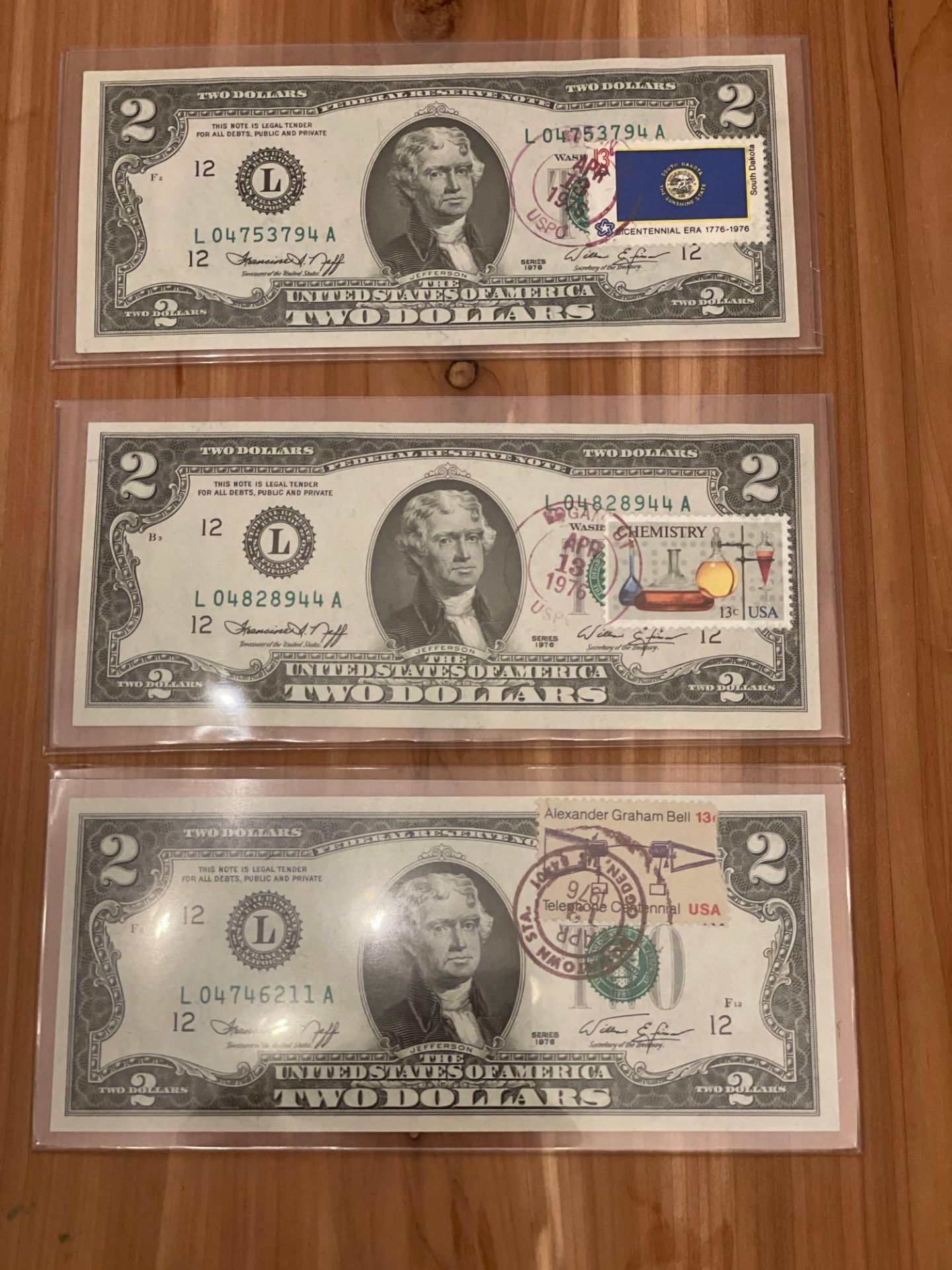 (3) 1976 $2 Notes with first day issues postage stamps