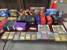 assorted cards Pokemon some with cases and graded some in bulk