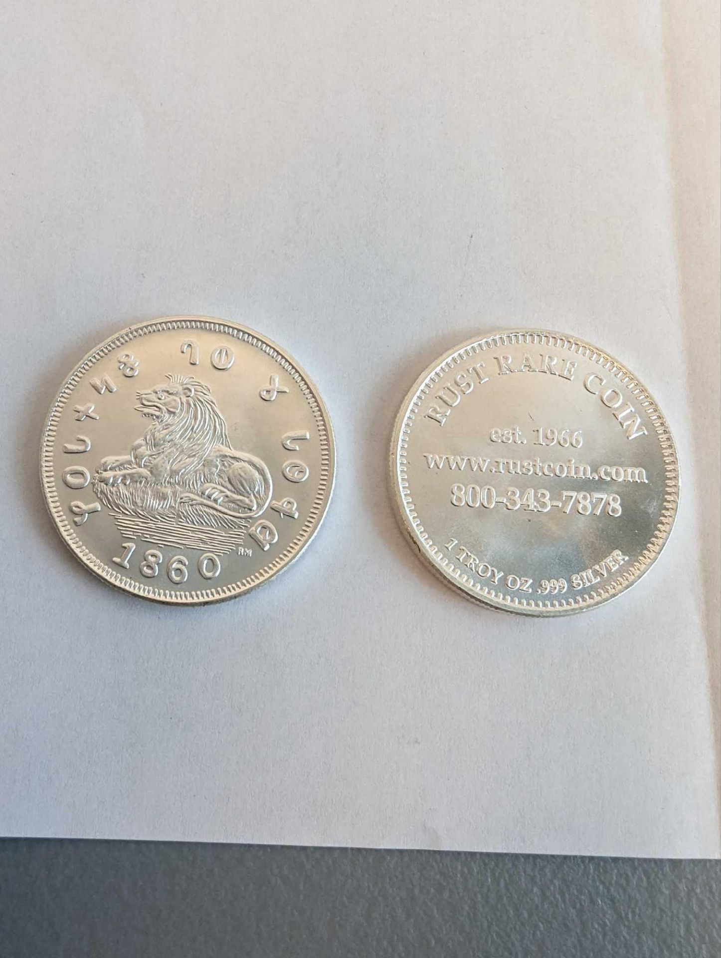 2 silver coins. Rust coin