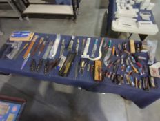 tabletop of knives daggers, sickles and more