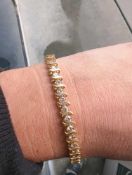 14 karat yellow gold diamond line bracelet with 38 diamonds with appraisal from OC