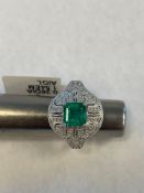 Platinum emerald and diamond ring 1.4 karat emerald.26 carat diamond