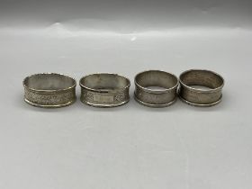 Four HM Silver Napkin Rings and HM Silver Spoon Su