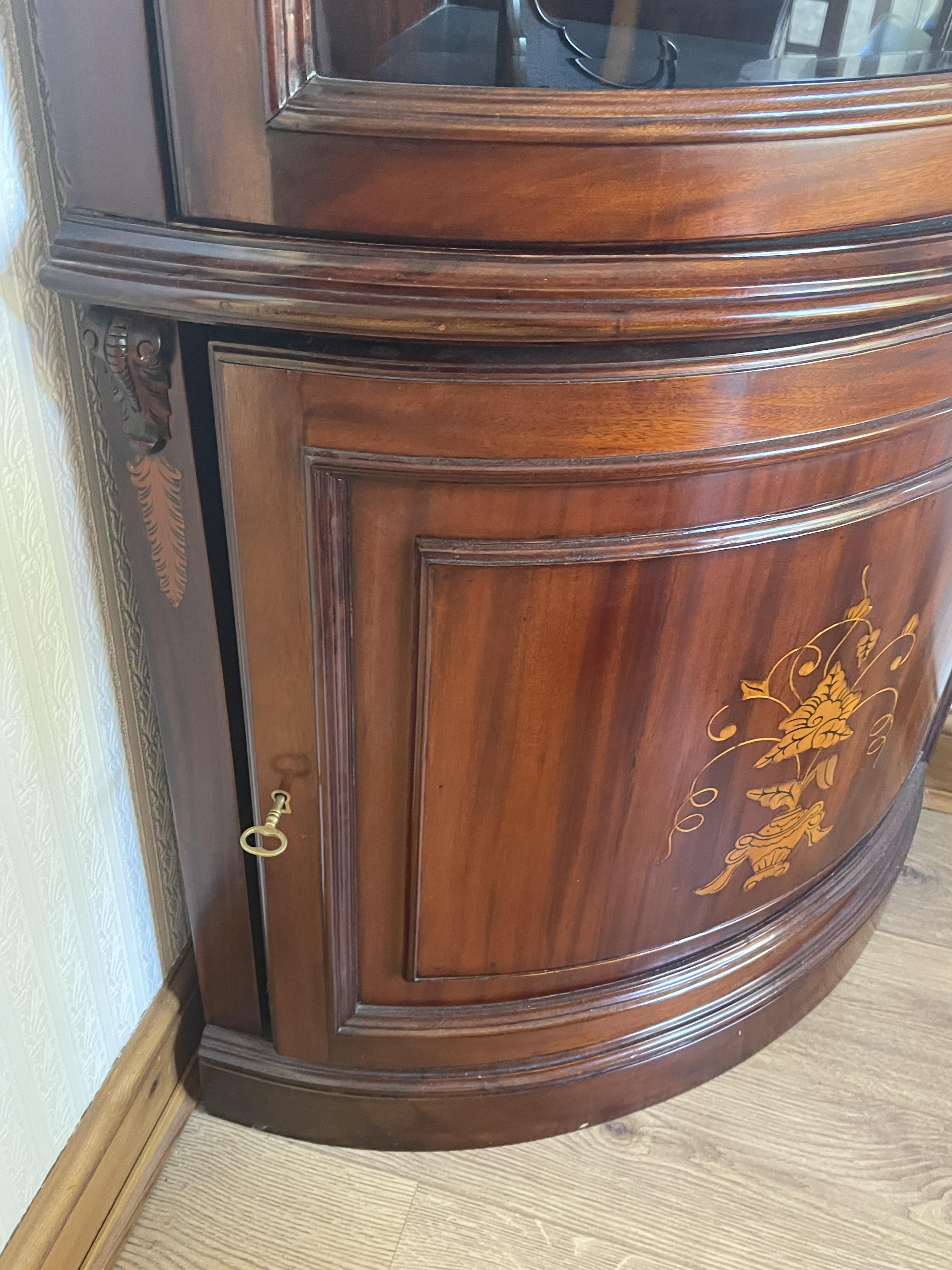 A mid to late 20th century mahogany bow fronted double corner cabinet. - Image 13 of 23