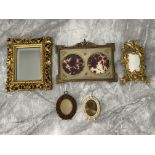 Assortment ornate picture frames.