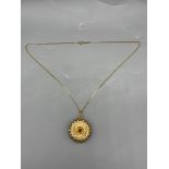 18ct Yellow Gold Flower Pendant along with 18ct Ye