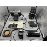 Minolta SRT101 Camera along with various photograp