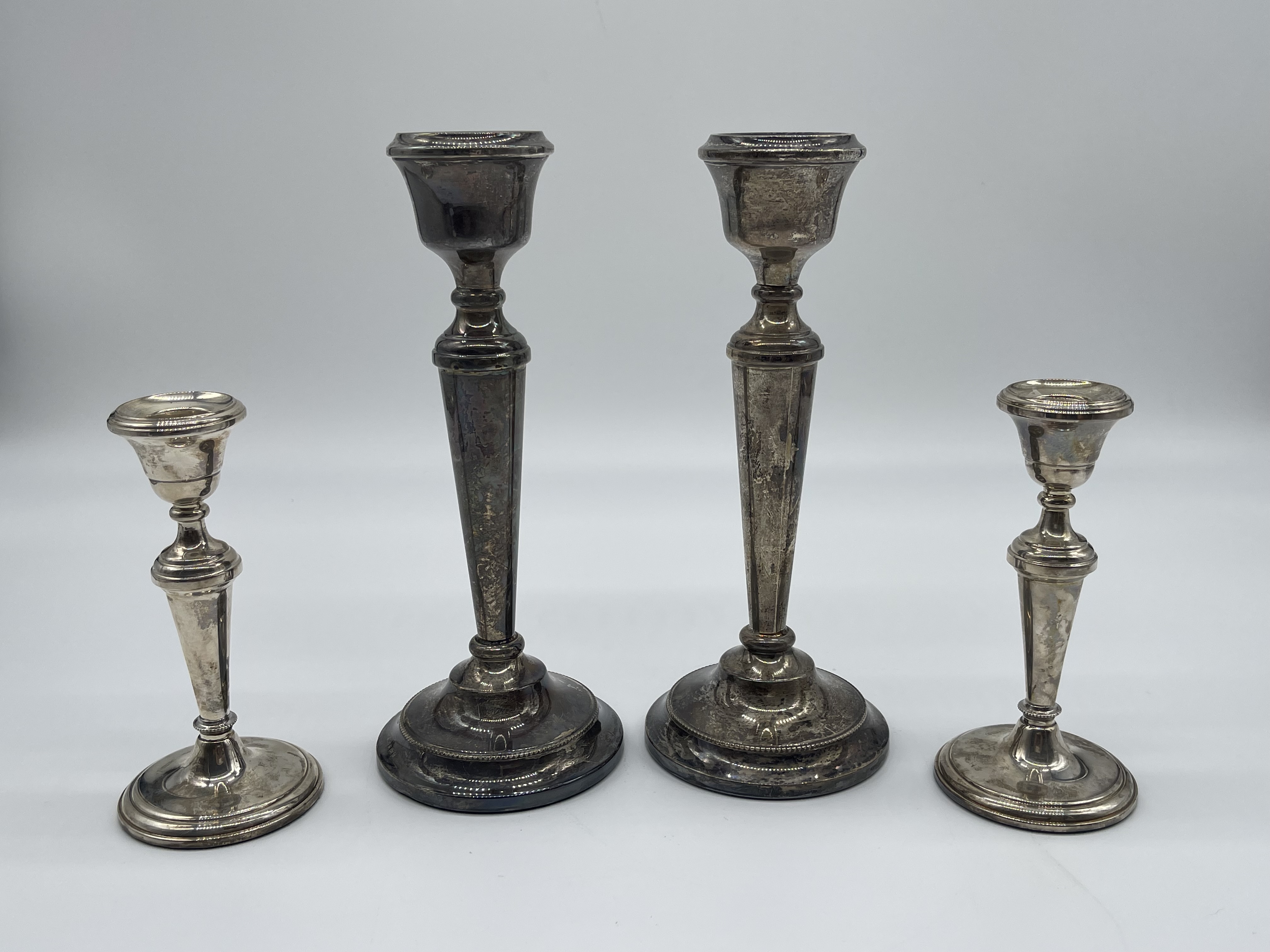 Two Pairs of HM Silver Candlesticks.