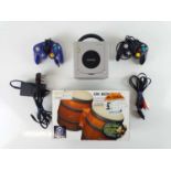 Nintendo Game Cube console - released in 2001 - with 2 controllers, one blue, one black - unboxed,