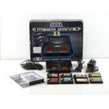 Sega Mega Drive II console - released in 1992 - only one control pad - includes 9 game