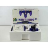 Nintendo 64 console- released in 2000 - purple see through version - in original box, appears
