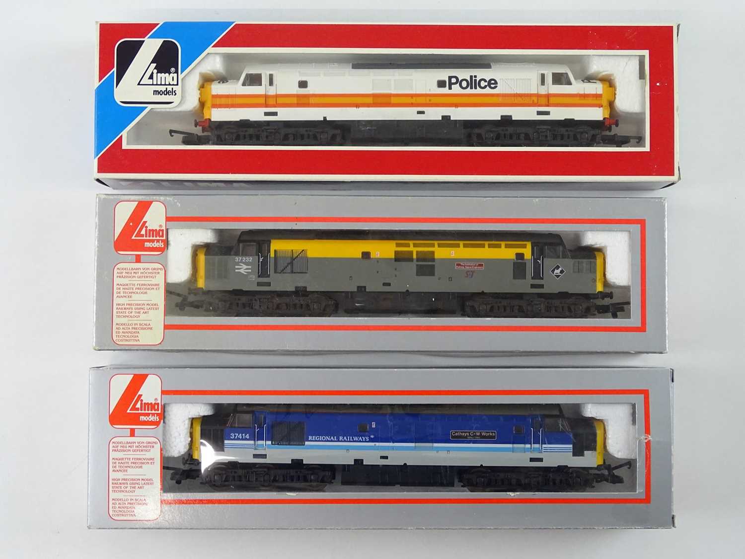 A group of LIMA OO Gauge class 37 diesel locomotives, in various liveries including a Police