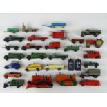 A quantity of playworn early and later DINKY vans, lorries and other items, some for spares or