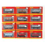 A group of HORNBY OO gauge wagons including hoppers and brake vans - VG/E in VG/E boxes (12)