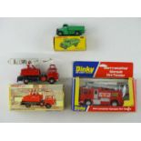 A mixed group of DINKY trucks comprising a 411 Bedford Truck, a 285 Merryweather Fire Engine and a