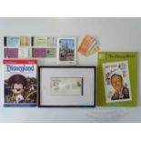 A selection of Disneyland memorabilia to include guide books, tickets, and a framed first day