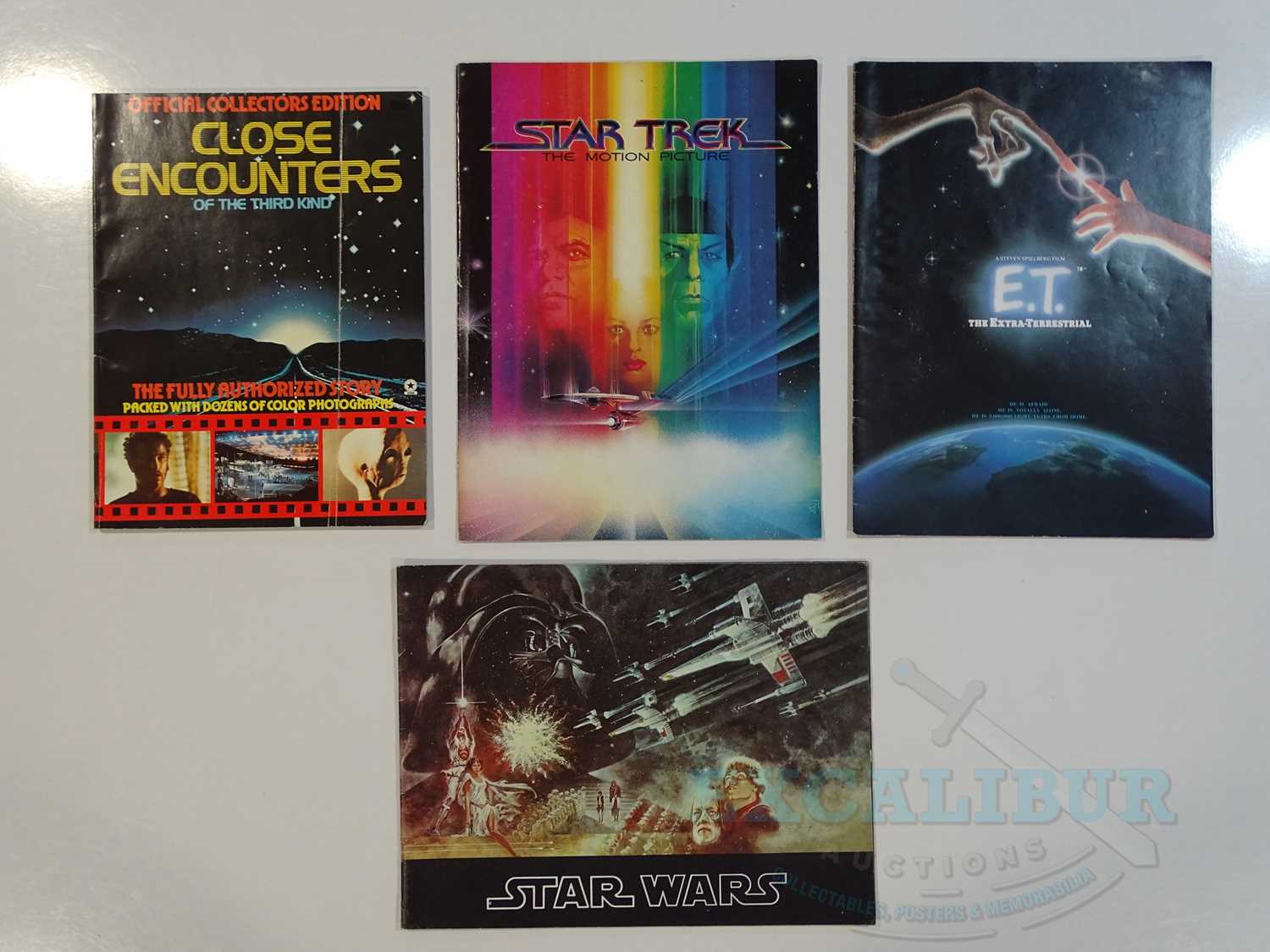 A group of 4 film brochures to include STAR WARS: A NEW HOPE (1977), CLOSE ENCOUNTERS OF THE THIRD