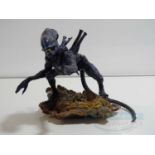 ALIENS (1986) - A unique handmade resin Alien figure attached to a large rock made by John