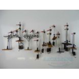 A group of kitbuilt O gauge signals, some with rudimentary remote control solenoid style mechanisms,