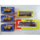 A FLEISCHMANN German Outline diesel locomotive together with 4 wagons by FLEISCHMANN and RIVAROSSI -