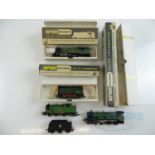 A group of WRENN OO gauge locomotives comprising a Class 4MT tank in Southern Green livery and a