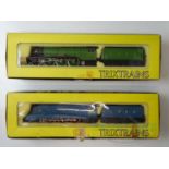 A pair of TRIX OO gauge LNER steam locomotives comprising a Flying Scotsman in green and Mallard