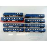 A group of TRI-ANG OO gauge Blue Pullman rolling stock comprising motorised car, dummy car and 6