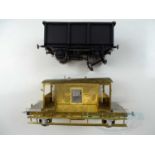 A pair of kitbuilt Gauge 1 wagons comprising a plastic mineral wagon (a/f) and a brass brake van,