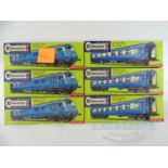 A group of KITMASTER OO gauge plastic kits for 'The Blue Pullman' - one example is built, the others