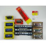 A mixed group of OO gauge rolling stock to include TRIX coaches (unboxes) together with boxed