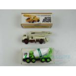 A pair of 1:50 Scale diecast construction lorries comprising an NZG 'Schwing' concrete pump and a