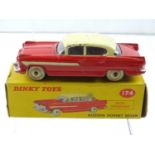 A DINKY 174 Hudson Hornet, with windows, red body with cream roof & side stripe - G in F/G correct