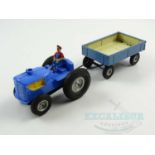 A GOTZ (GOSO) German tinplate and plastic clockwork tractor & trailer circa 1950s - G/VG unboxed