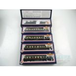 A group of BACHMANN OO gauge GWR rolling stock comprising a class 43xx in green and a rake of four