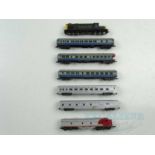 A group of unboxed American outline N gauge rolling stock including diesel locos and coaches - G