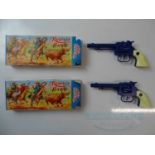 A pair of vintage CRESCENT 'Rustler Hawk' toy cap guns in blue with cream handgrips - VG in G