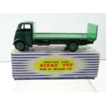 A DINKY 513/913 Guy Flat Truck, 2nd Style Cab with Tailboard in dark / mid green, early 1947 example