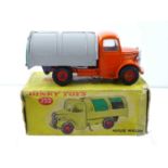 A DINKY 252 Refuse Truck, rarer late version with windows and plastic hubs, orange, grey & green -