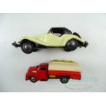 A pair of unboxed Japanese tinplate friction drive vehicles comprising an MG sports car and a petrol