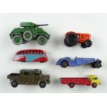 A mixed group of vintage diecast vehicles by various manufacturers, mostly playworn with a repainted