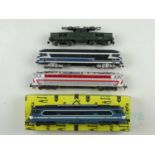 A group of unboxed JOUEF HO gauge French outline diesel and electric locomotives in various SNCF