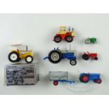 A group of diecast tractors by ERTL, MATCHBOX and others - F/VG in G box where boxed (7)