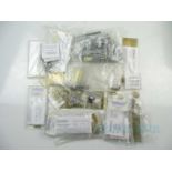 A quantity of OO gauge motors, accessories and chassis packs in brass and nickel silver for kit