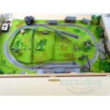 An N gauge tabletop / coffee table layout with scenery. Complete with controller and case which