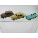 A group of three unboxed DINKY cars & racing cars, consisting of 40e Standard Vanguard, fawn